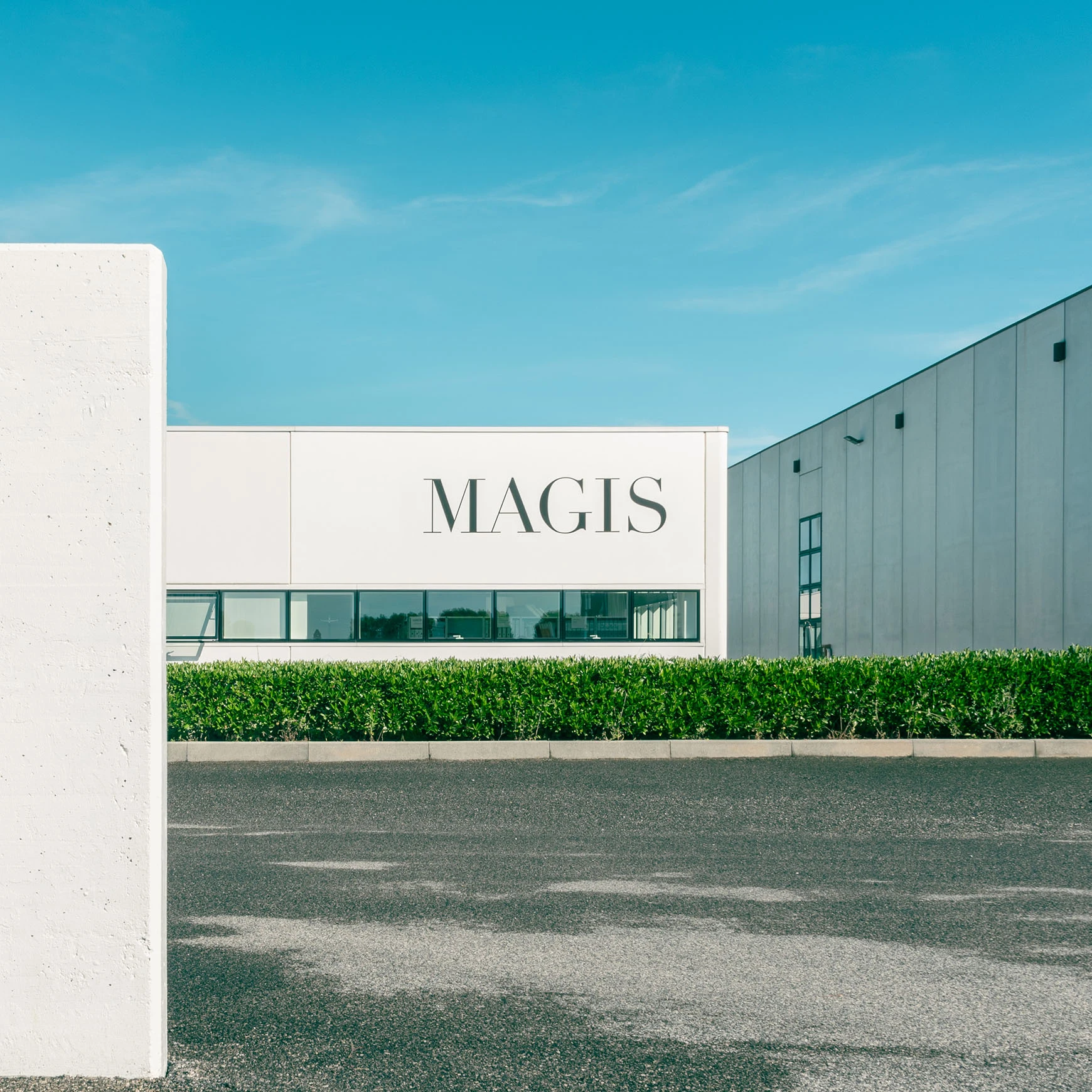 Magis headquarters building with the company sign