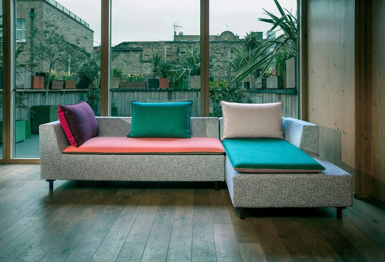 Barbican sofa in front of a window wall