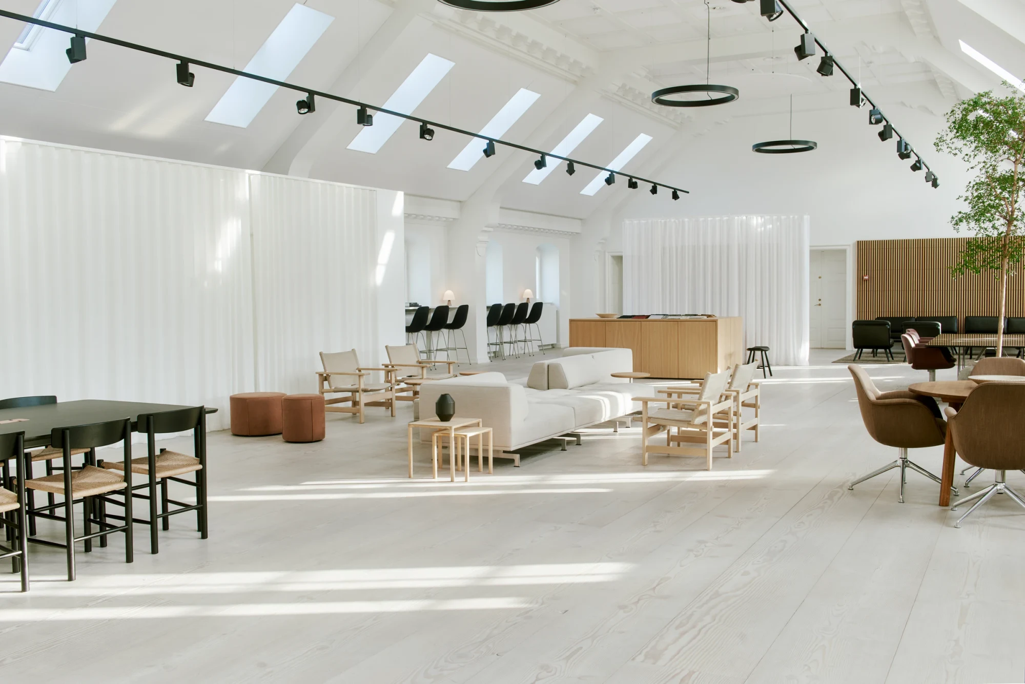 Fredericia showroom with a lounge area under a skylit ceiling