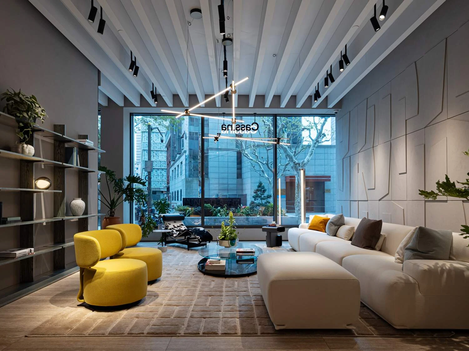Cassina showroom with a white sofa and yellow armchairs