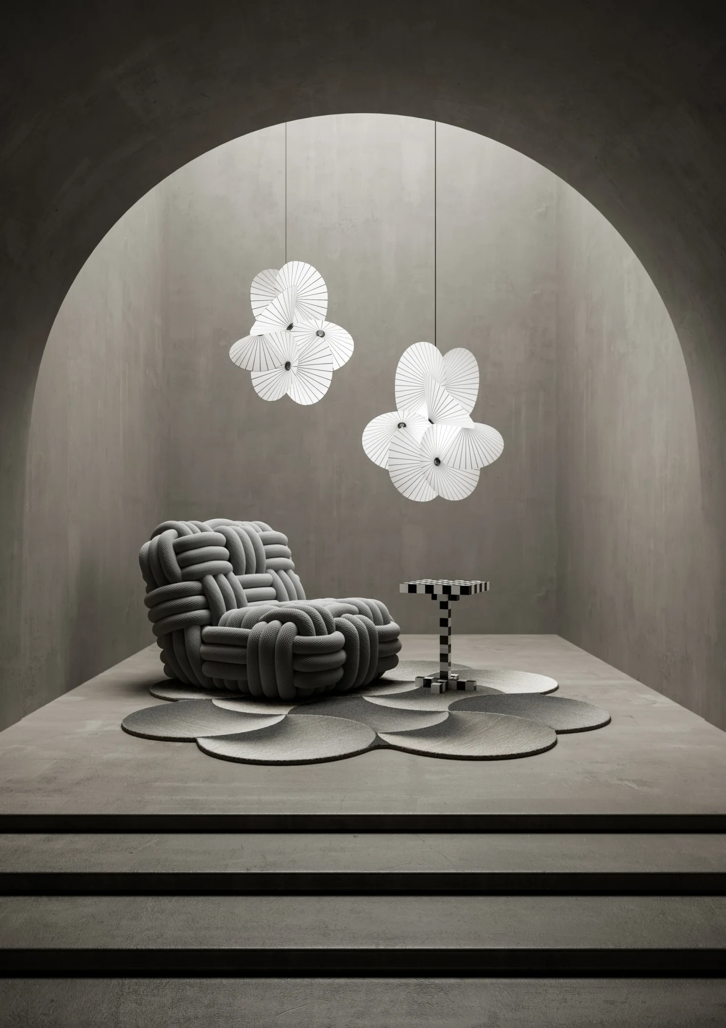 Moooi Serpentine pendant lamps above a knotted armchair