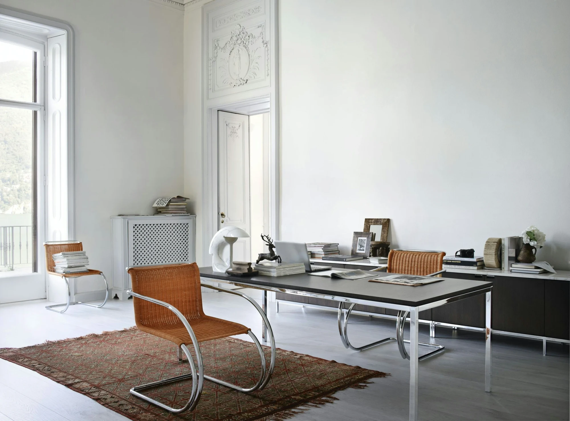 Knoll cantilever chair at a desk in a bright room