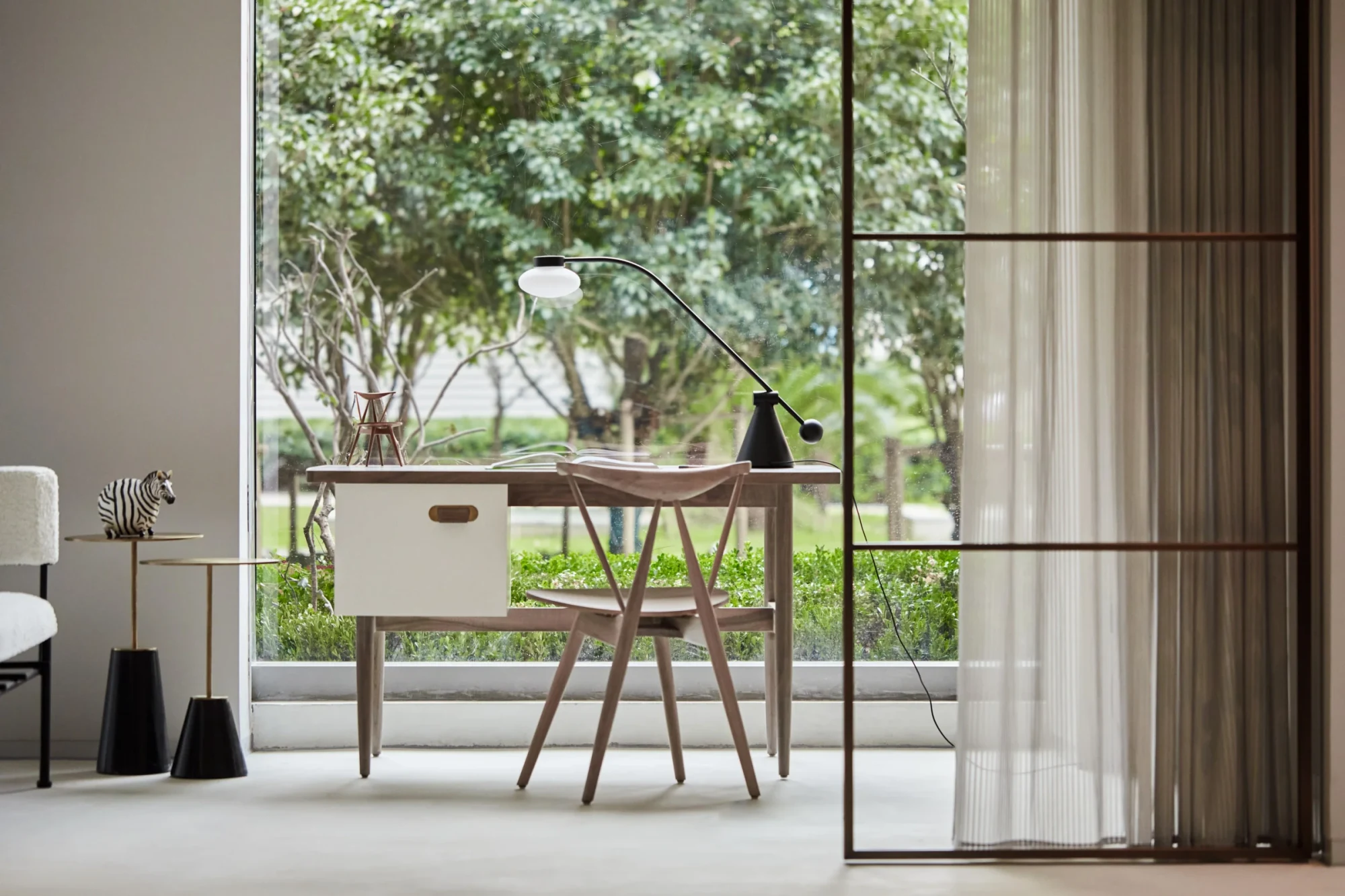 Stellar Works desk and chair in a room with a garden view