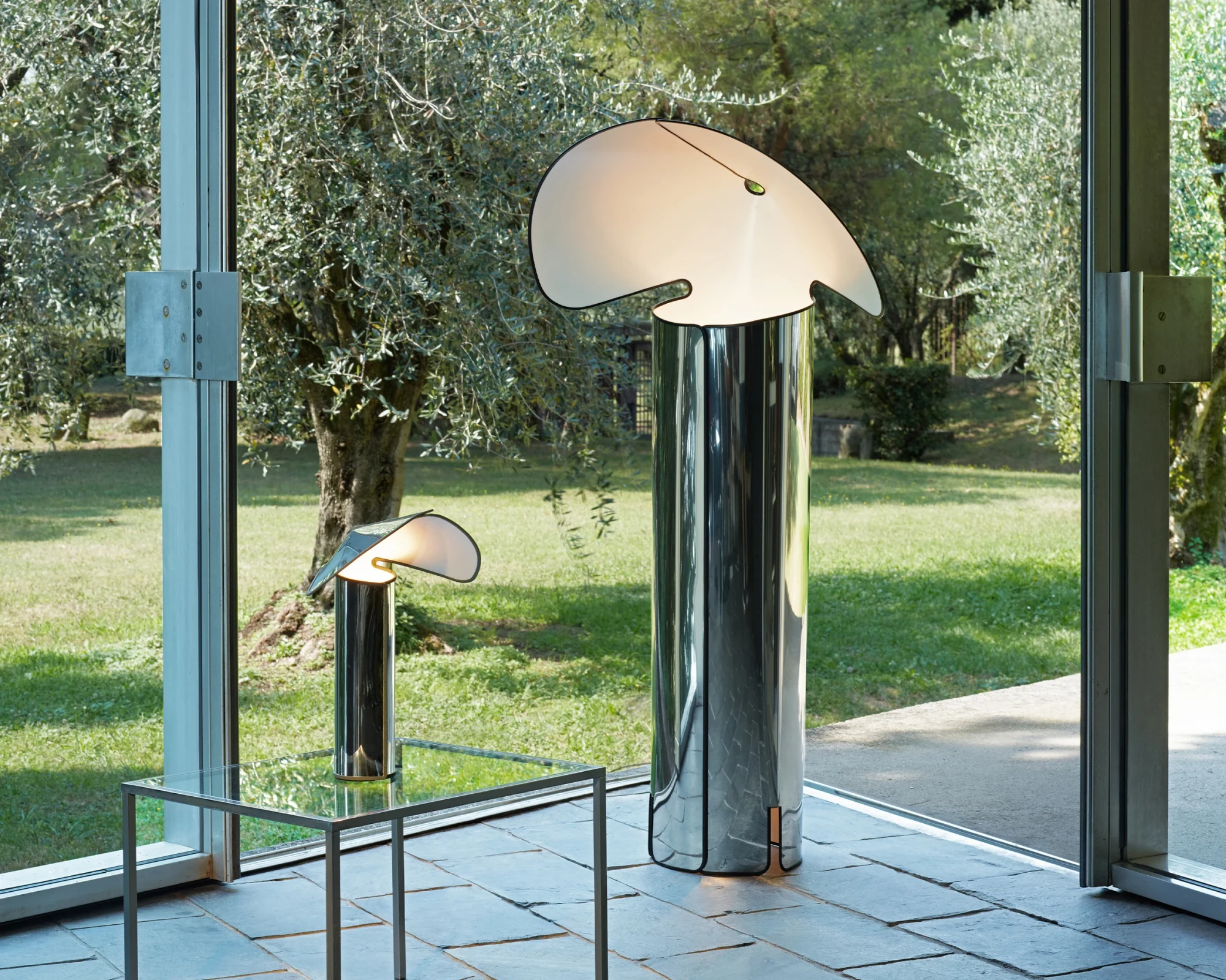 Chiara lamps in polished steel by a window