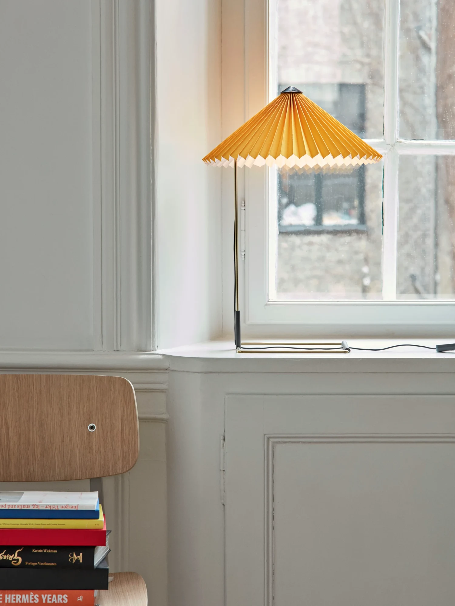 HAY pleated yellow table lamp by a window