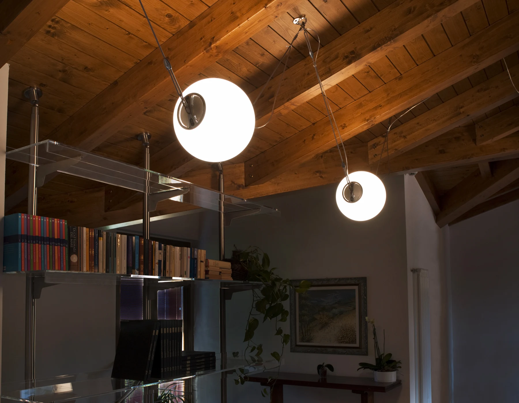 Lumina Perla spherical pendant lamps under a timber ceiling