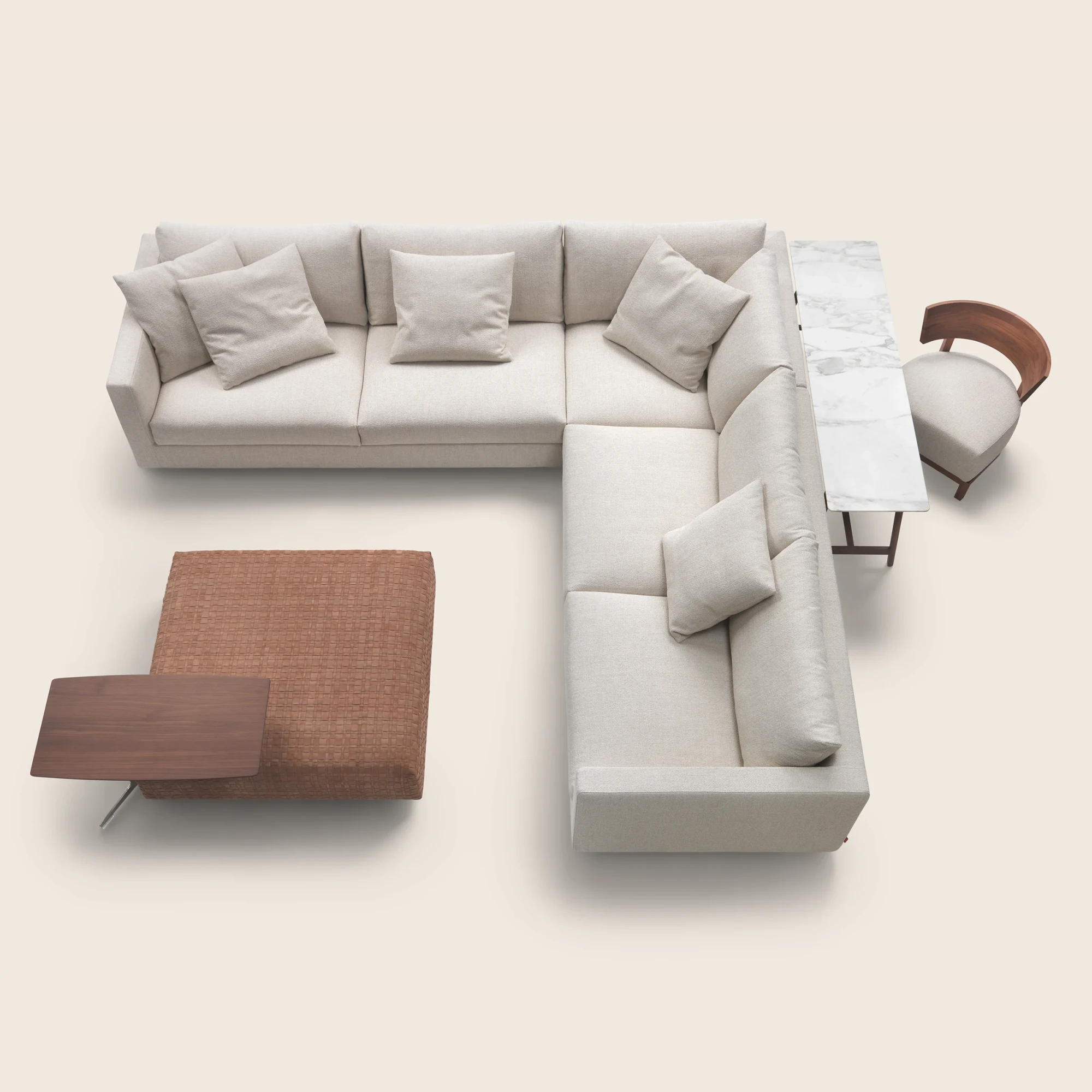 L-shaped Magnum sectional seen from above with a table and an armchair
