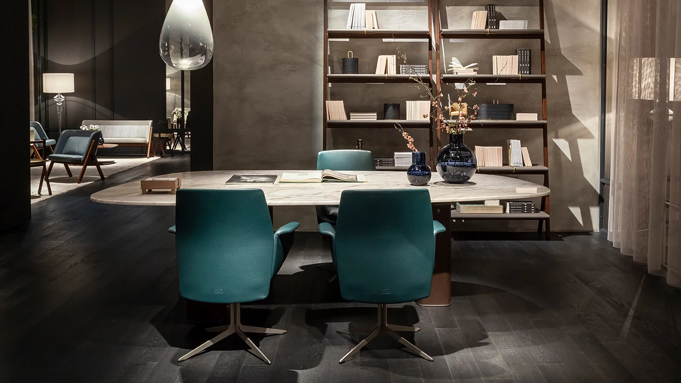 Swivel chairs gathered round an oval table