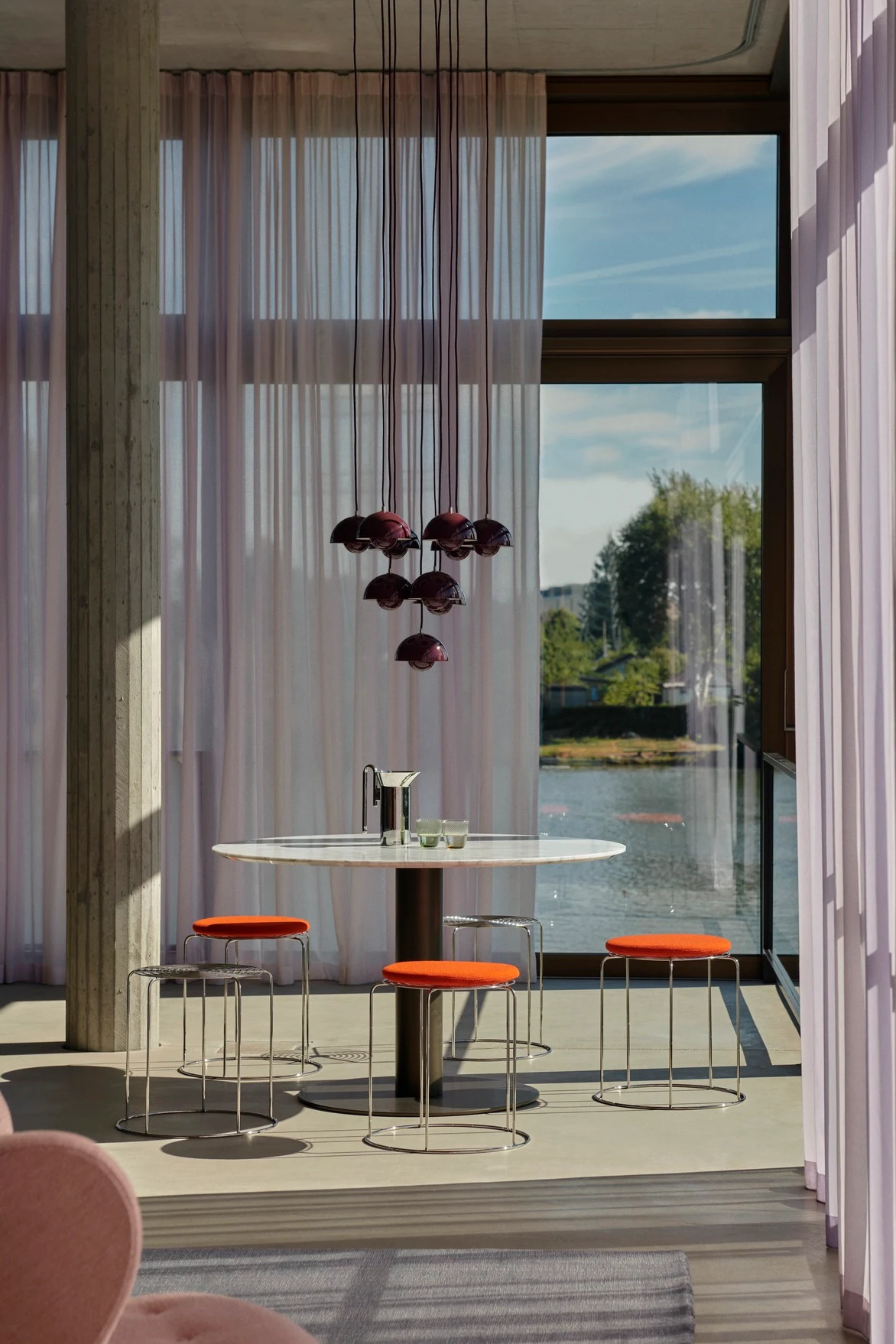 Wire Stools with seat pads at a round table