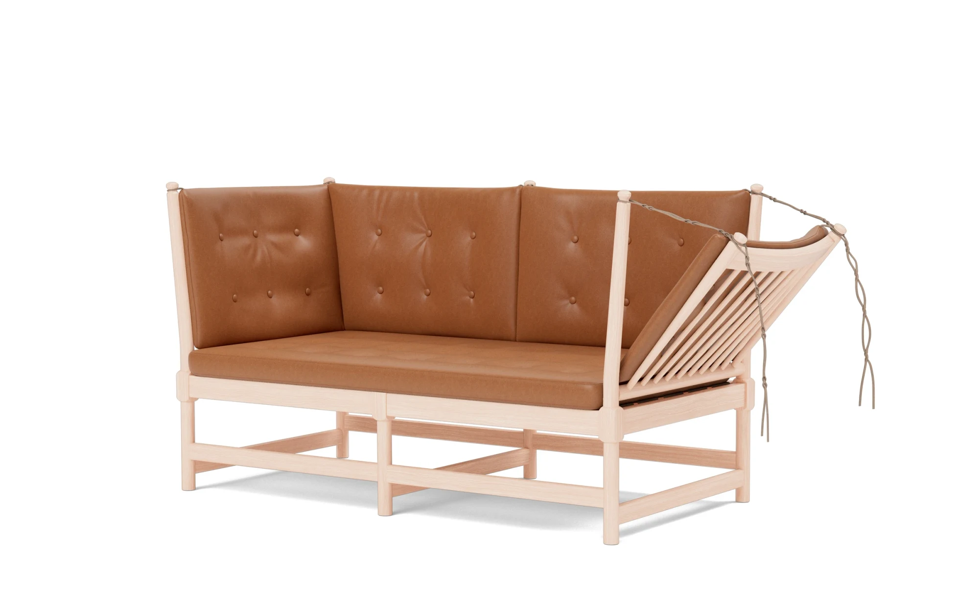 The Spoke-Back Sofa with leather cushions and a folded-down side, three-quarter view on a white background