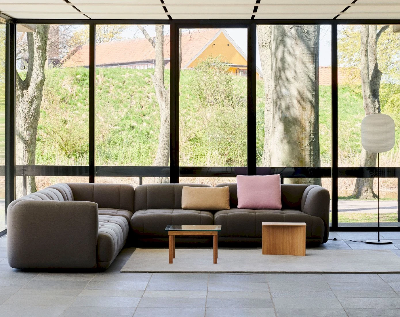 A Quilton corner sofa with a low table in a room