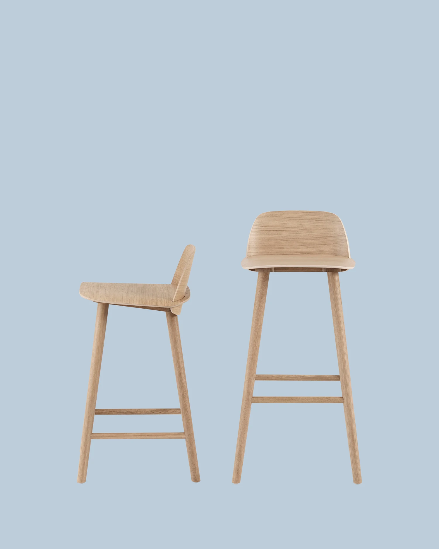 Two Nerd stools of different heights on a plain backdrop
