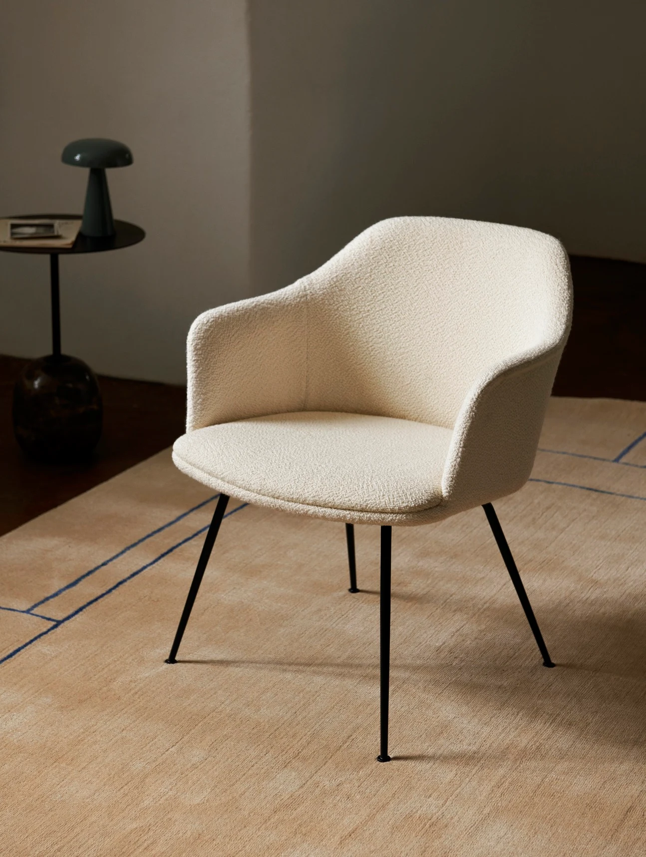 An armchair beside a small round table