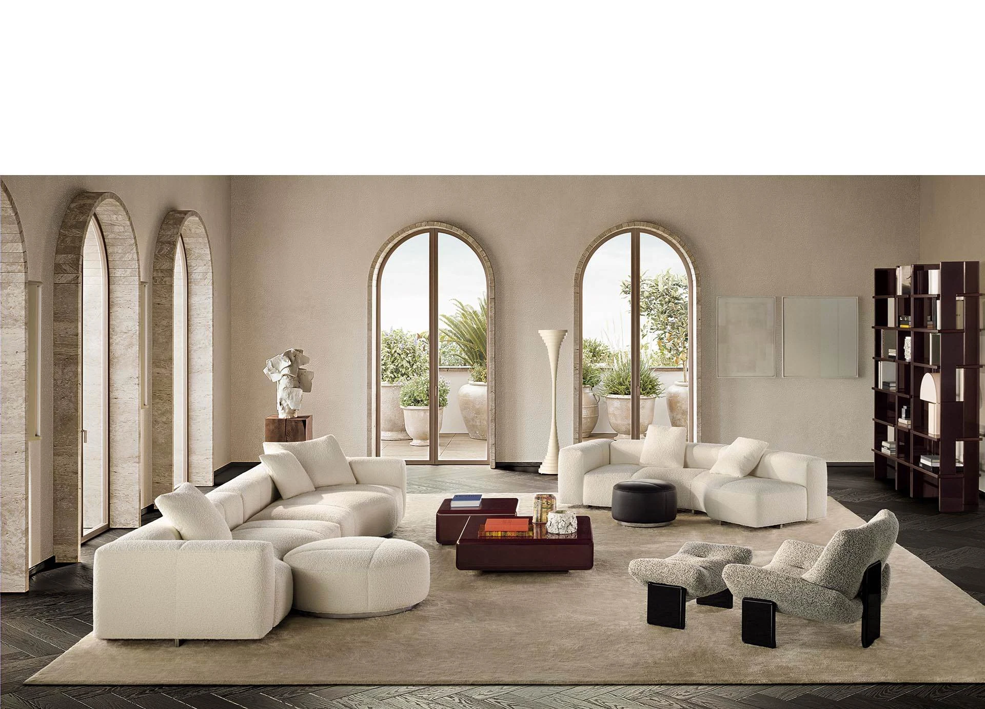 A room with arched windows, several sofa groups, armchairs and a low table, official Minotti photo
