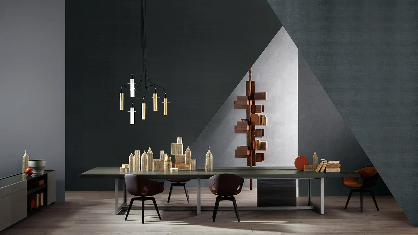 Jobs meeting table with four chairs in a room with a hanging light fixture