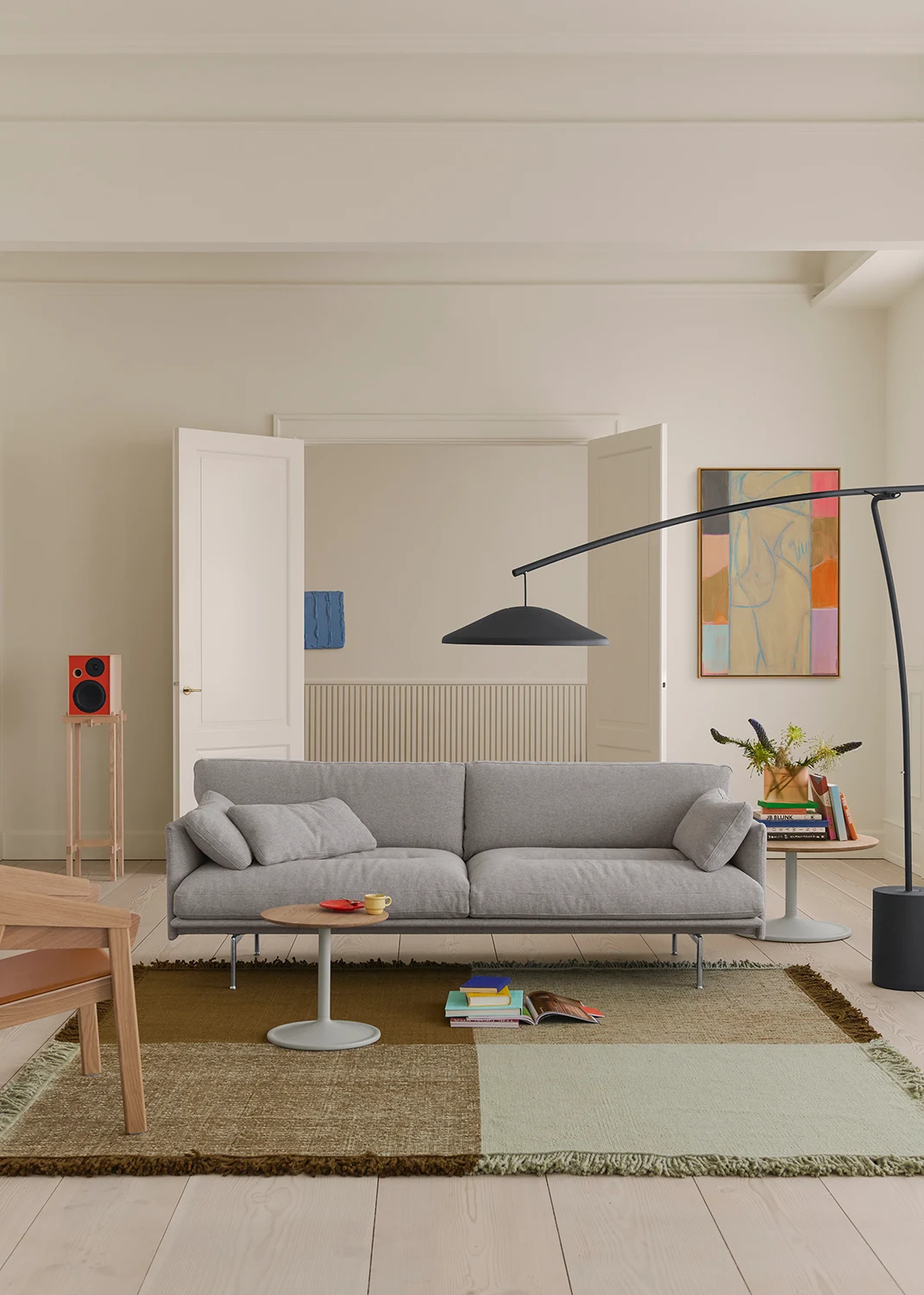 Outline Soft sofa with a floor lamp, a rug and a low table in a bright room