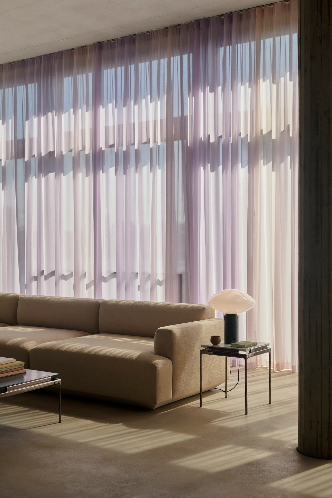 Develius sofa in a room with a curtain