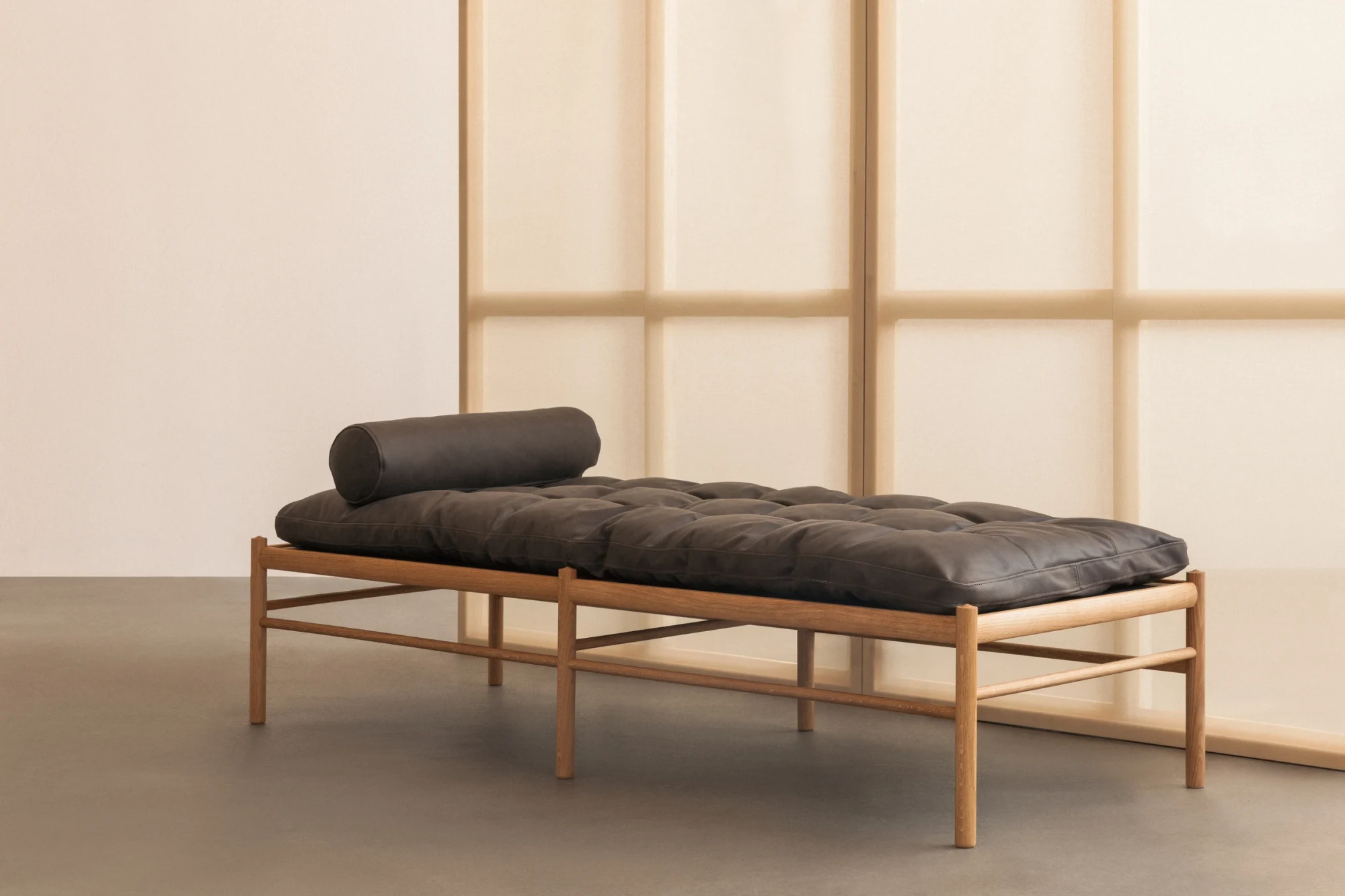 Daybed with a bolster in an interior photograph
