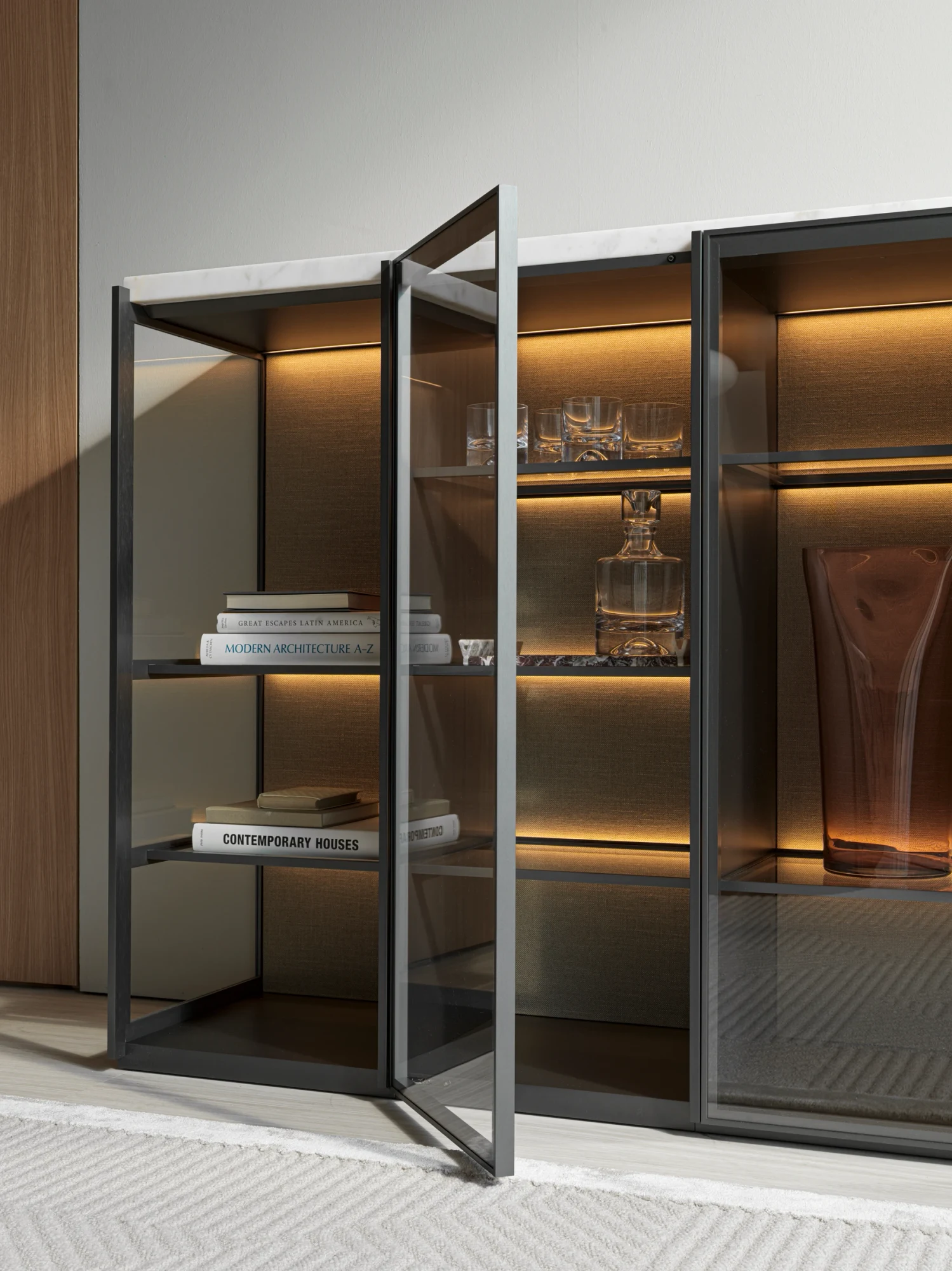 Tall glass cabinet with one door open