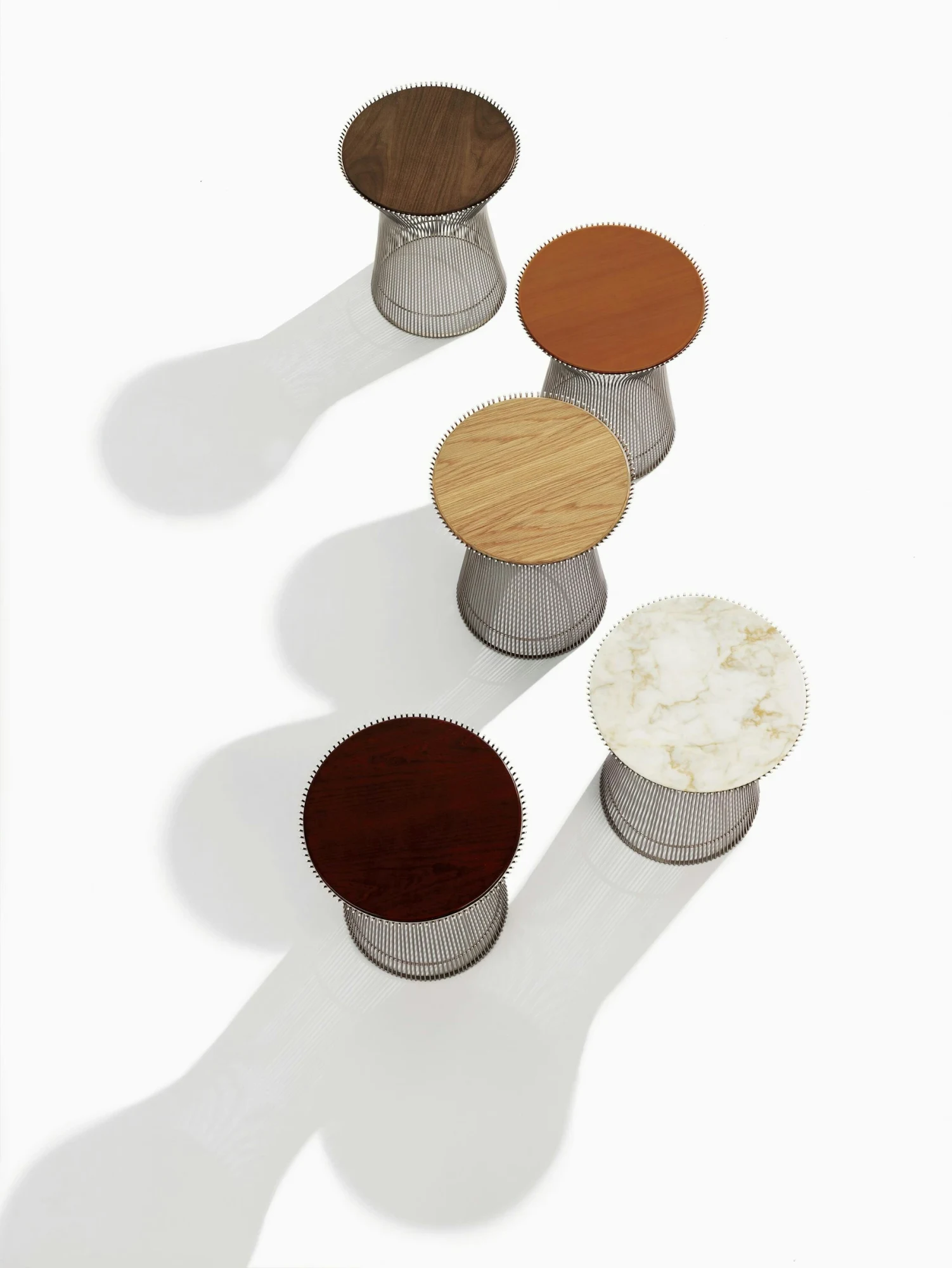 Five Platner side tables seen from above, each with a different top, official Knoll photograph KNO_PLT_6100