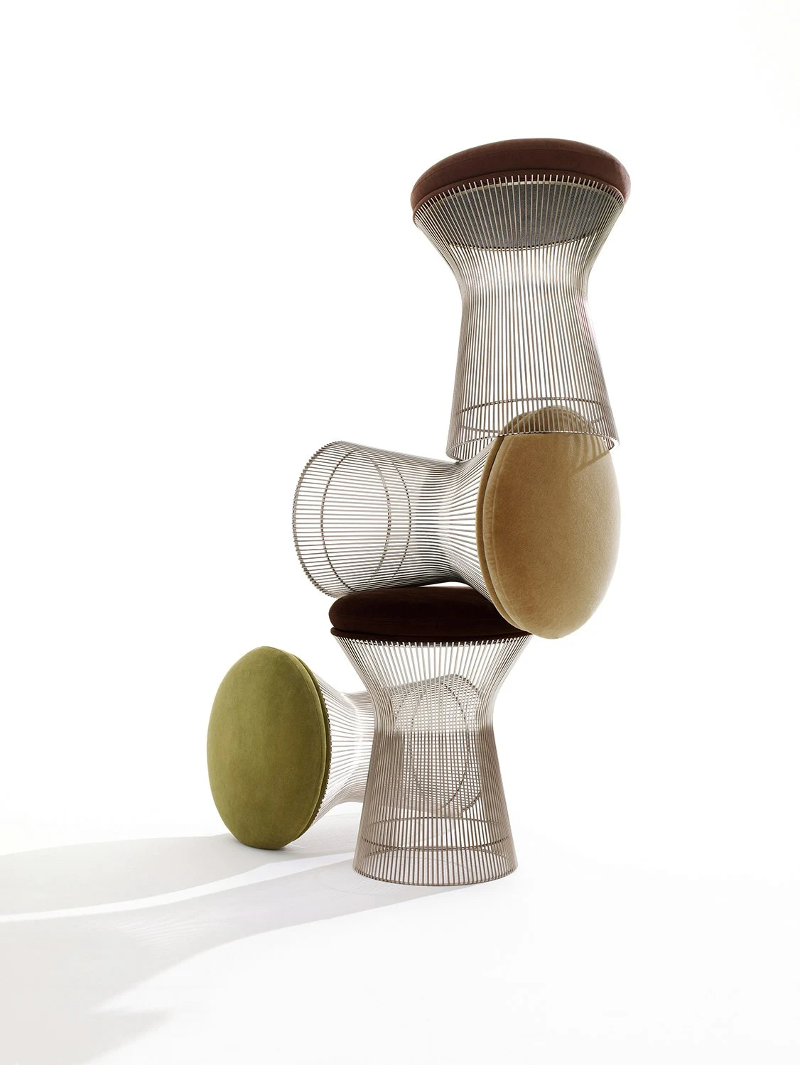 Platner stools stacked and tipped on a white background, Knoll picture 5393
