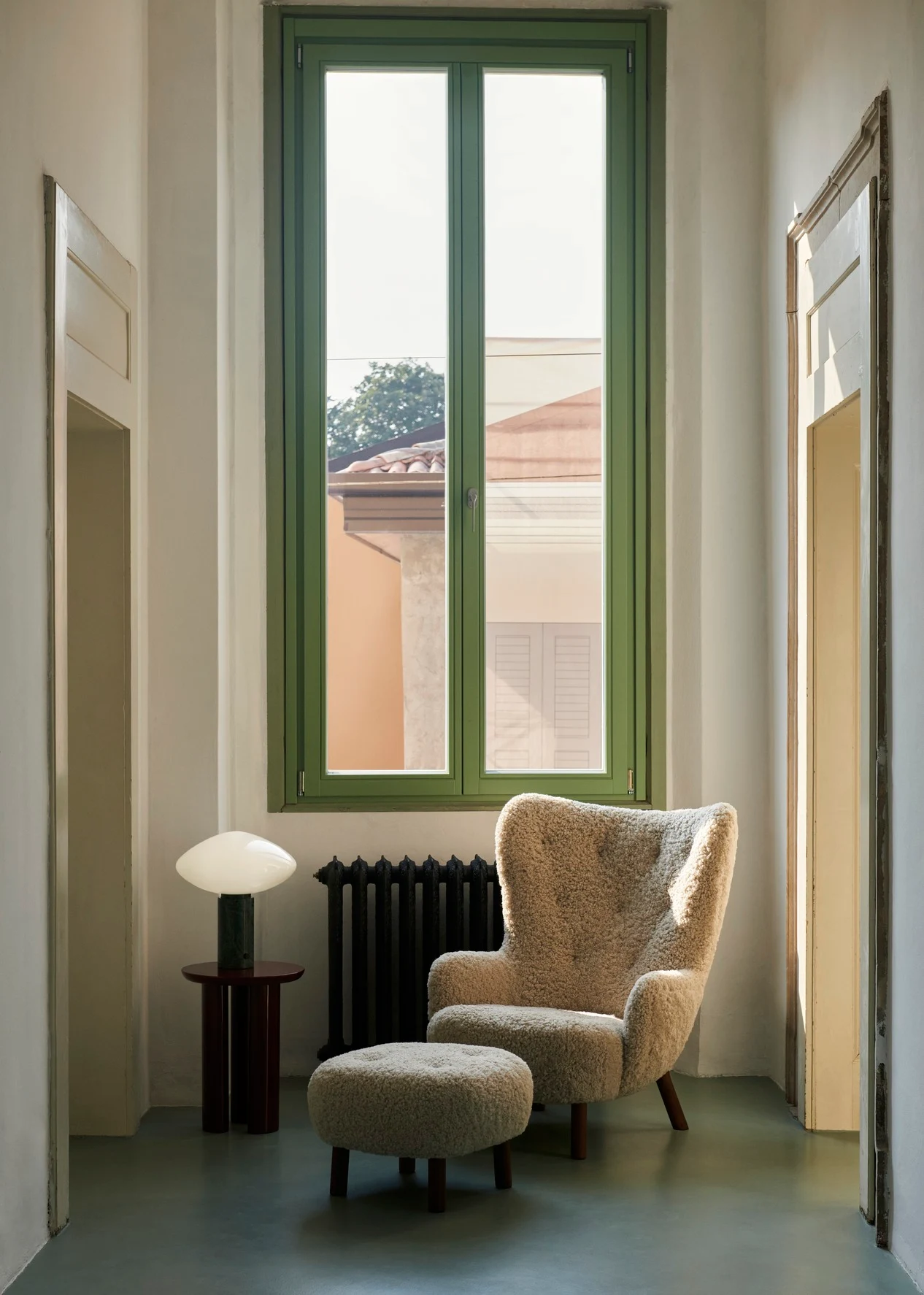 Petra VB3 with a pouf in a room