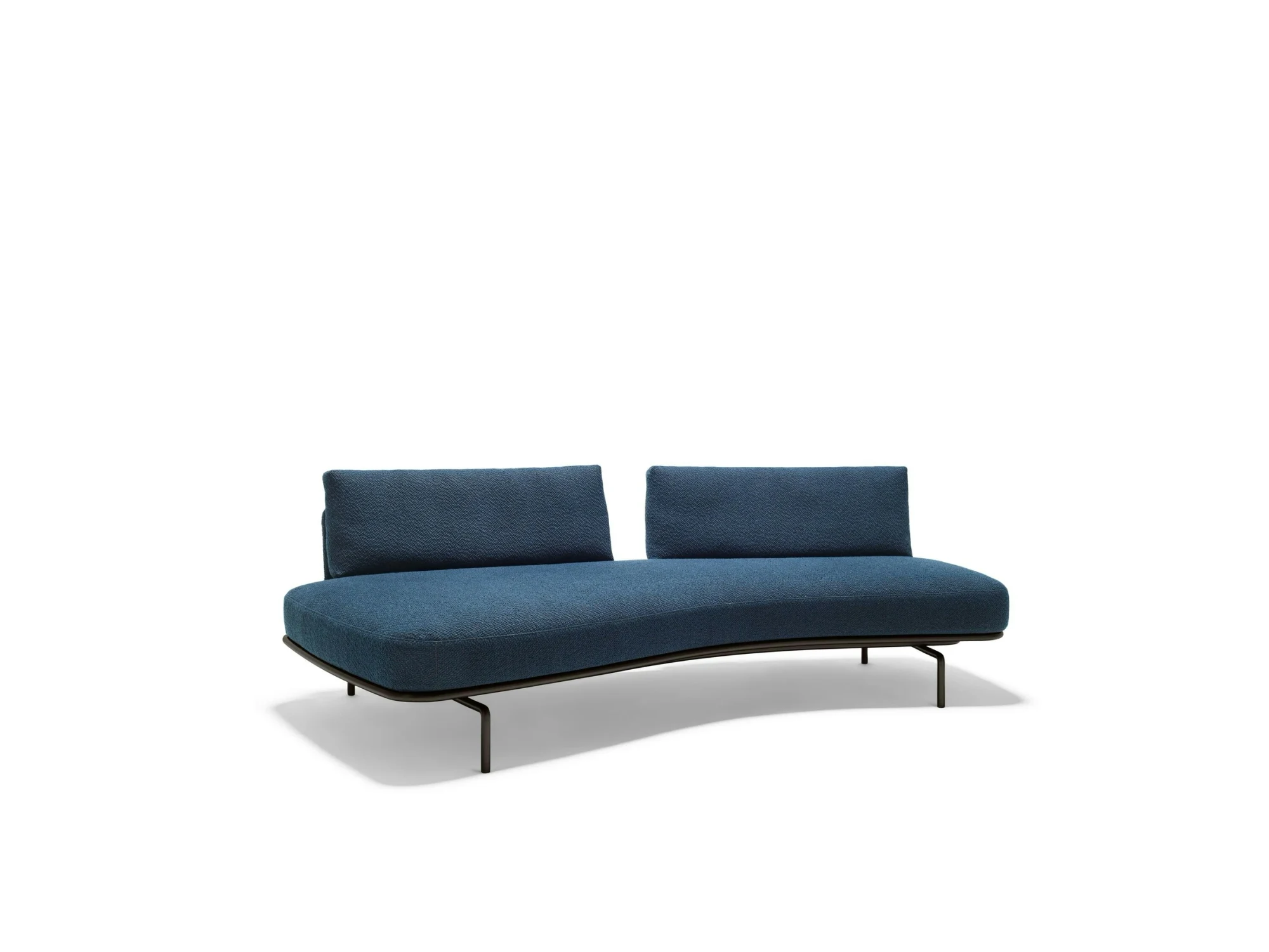 Panoramic sofa with two backrests in a three-quarter view on a plain studio background