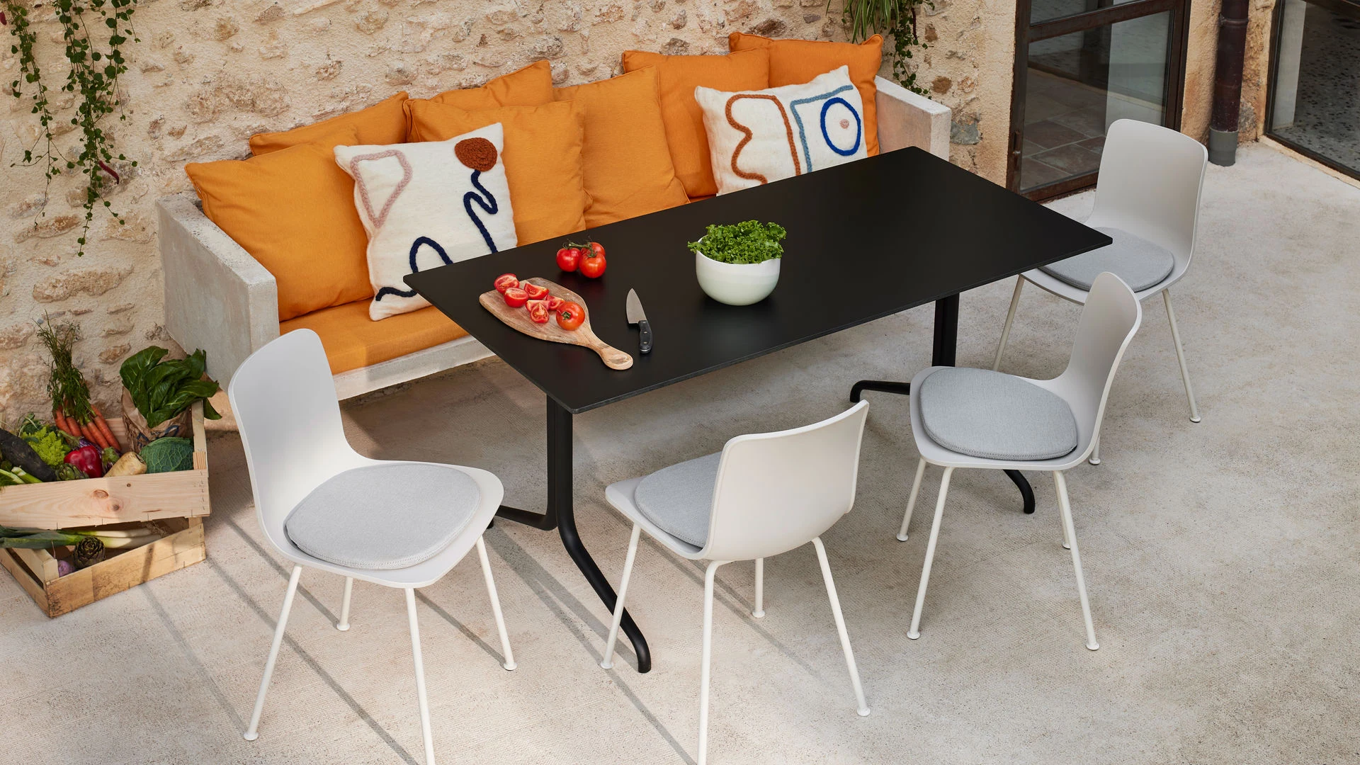 Chairs with tubular bases around a table
