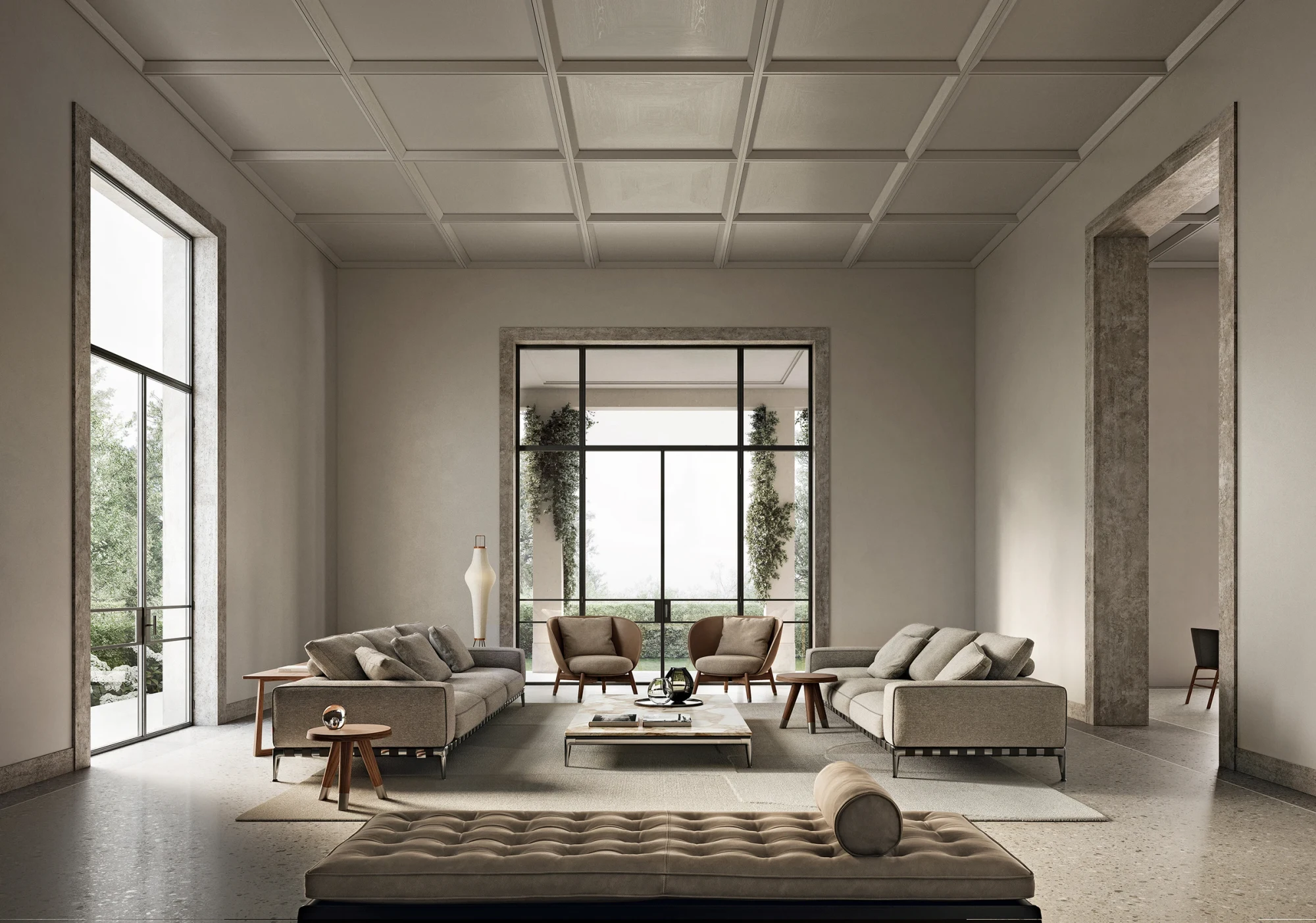 Sofás Gregory en una habitación con techo artesonado, un par de sillones y una mesa baja