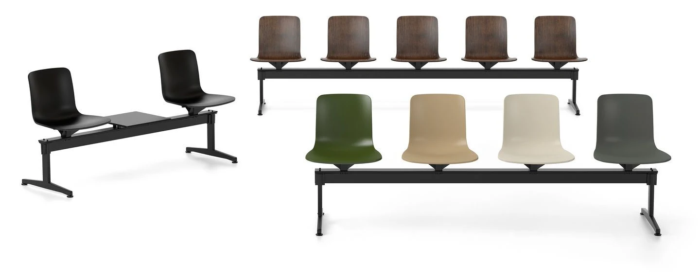 Beam seating with several shells and a table unit on a plain background