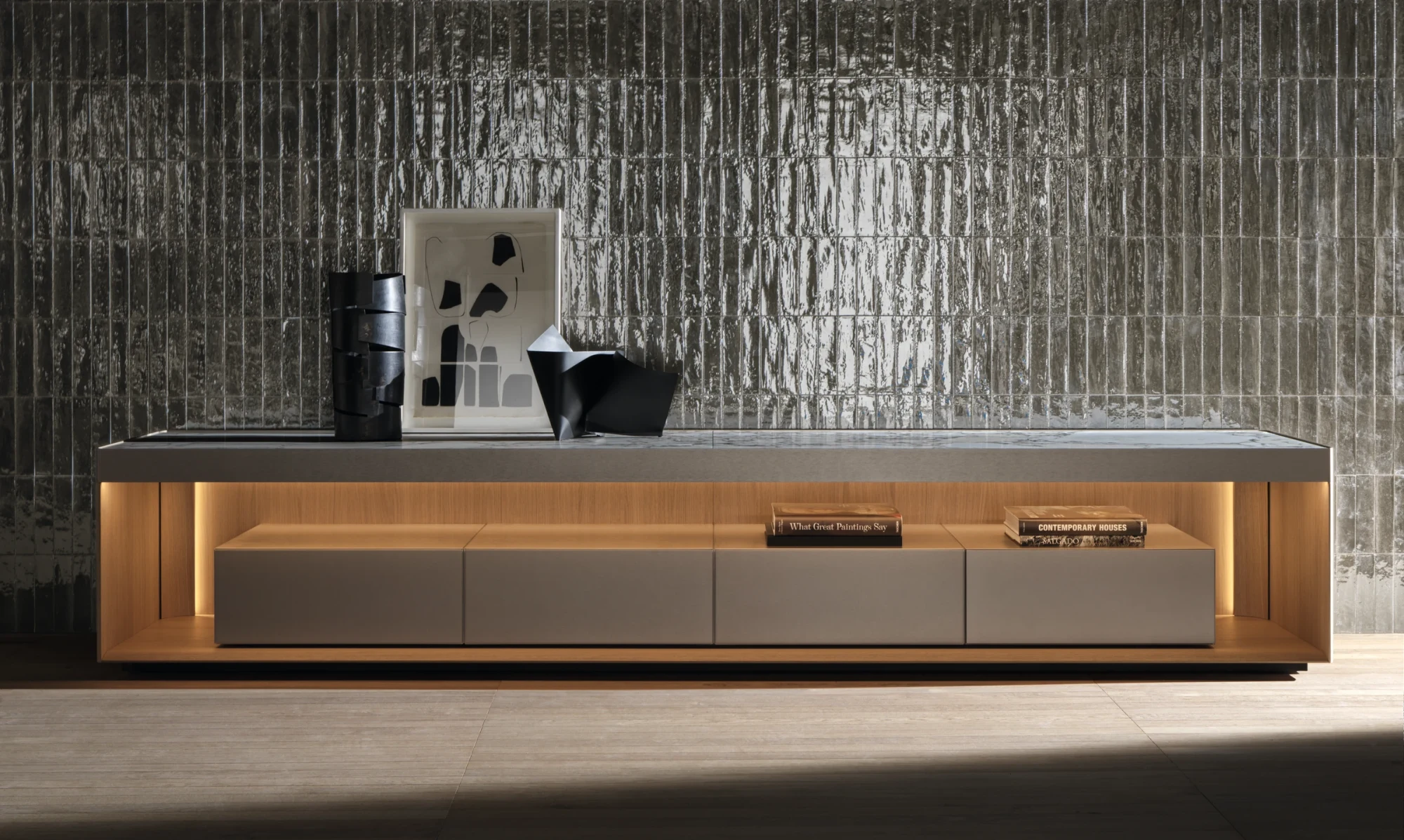 Long low unit with drawers and a lit open shelf below the top