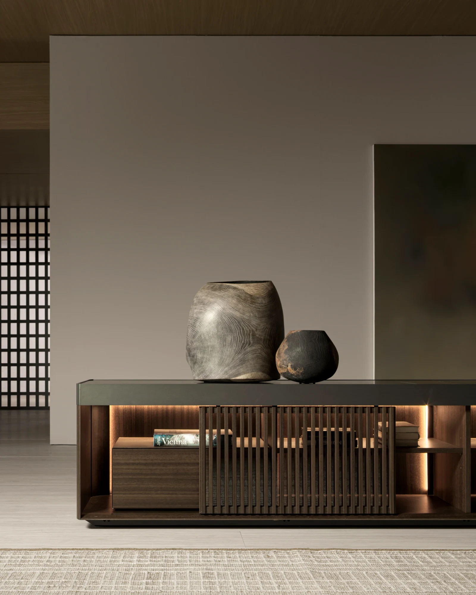 Unit with slatted sliding doors and lit compartments, with vessels on top