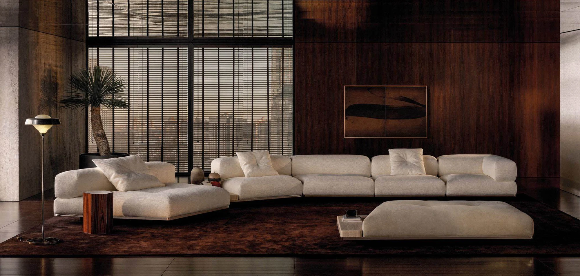 Orion arrangement with an ottoman in a dark wood-panelled room, official Minotti photo