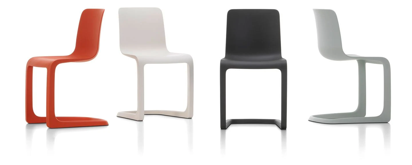Chairs with cantilever bases seen from different sides on a plain background