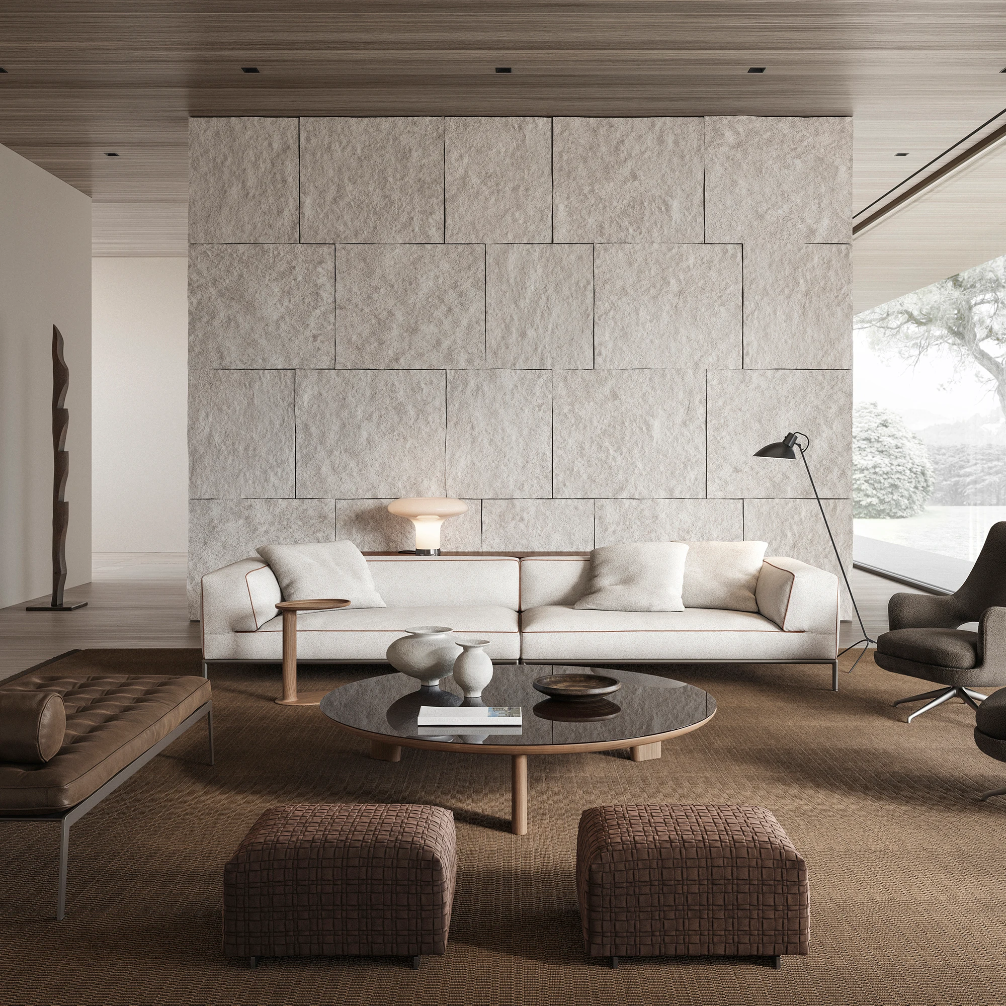 Perry Up sofa in a living room with two ottomans, a round table and a floor lamp