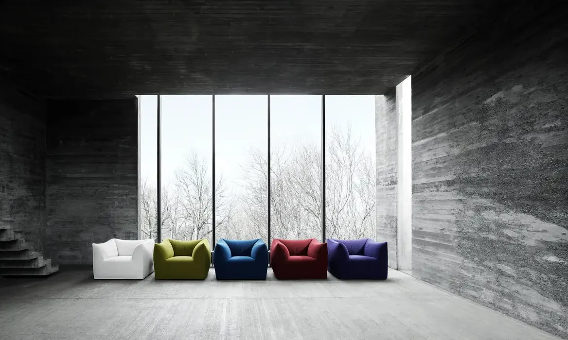 Five Le Bambole armchairs in a room with tall windows, official page photo
