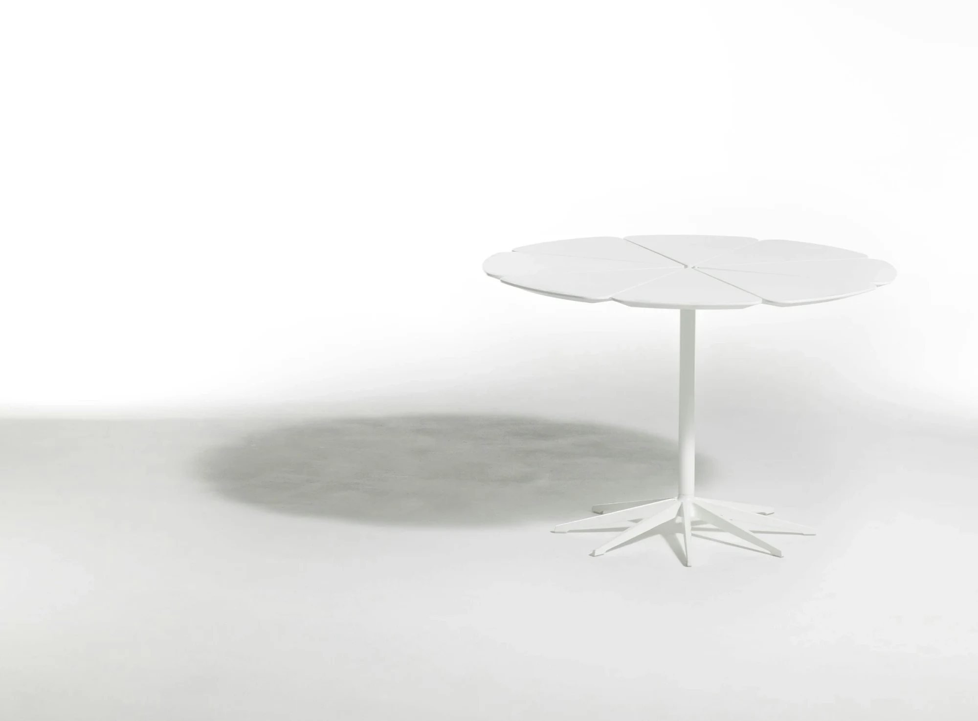 Petal dining table shown in an alternate studio view
