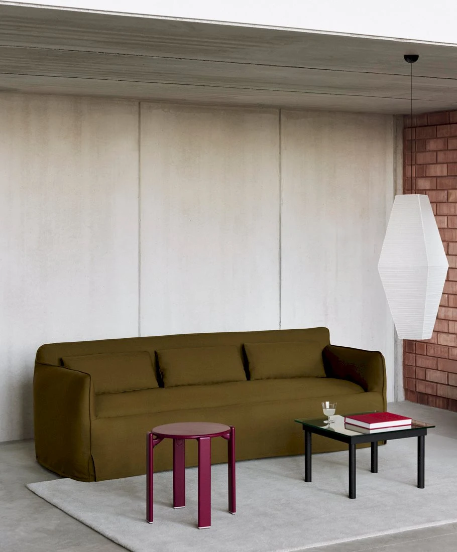 Mimi 3 Seater with a stool and a low table in a room with a hanging pendant lamp