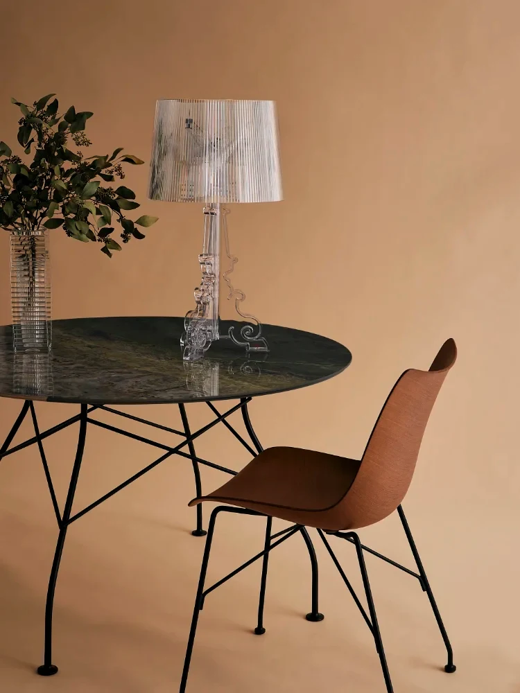 A P/Wood chair at a round table with a table lamp