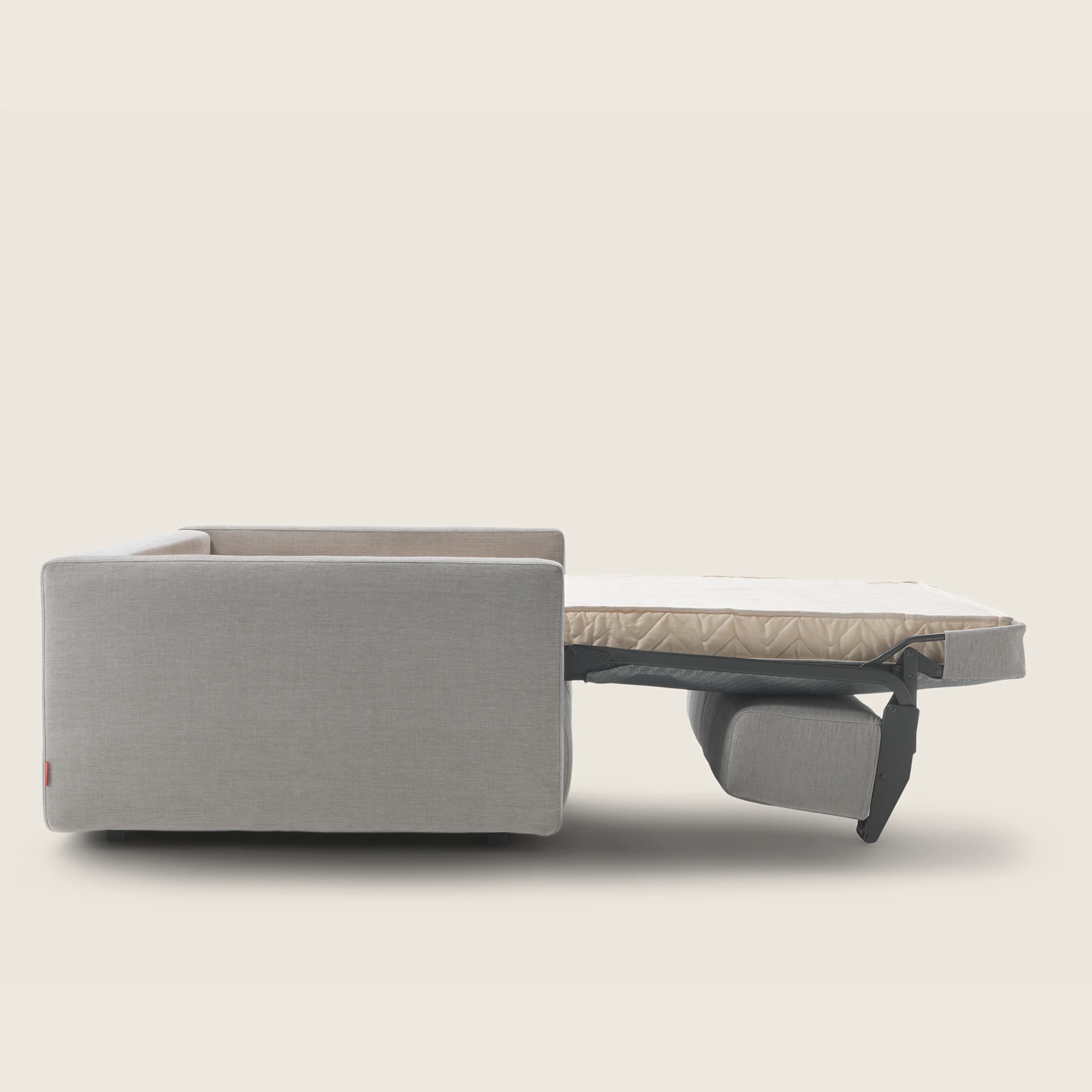Gary sofa bed with the bed folded out, seen from the side, plain background