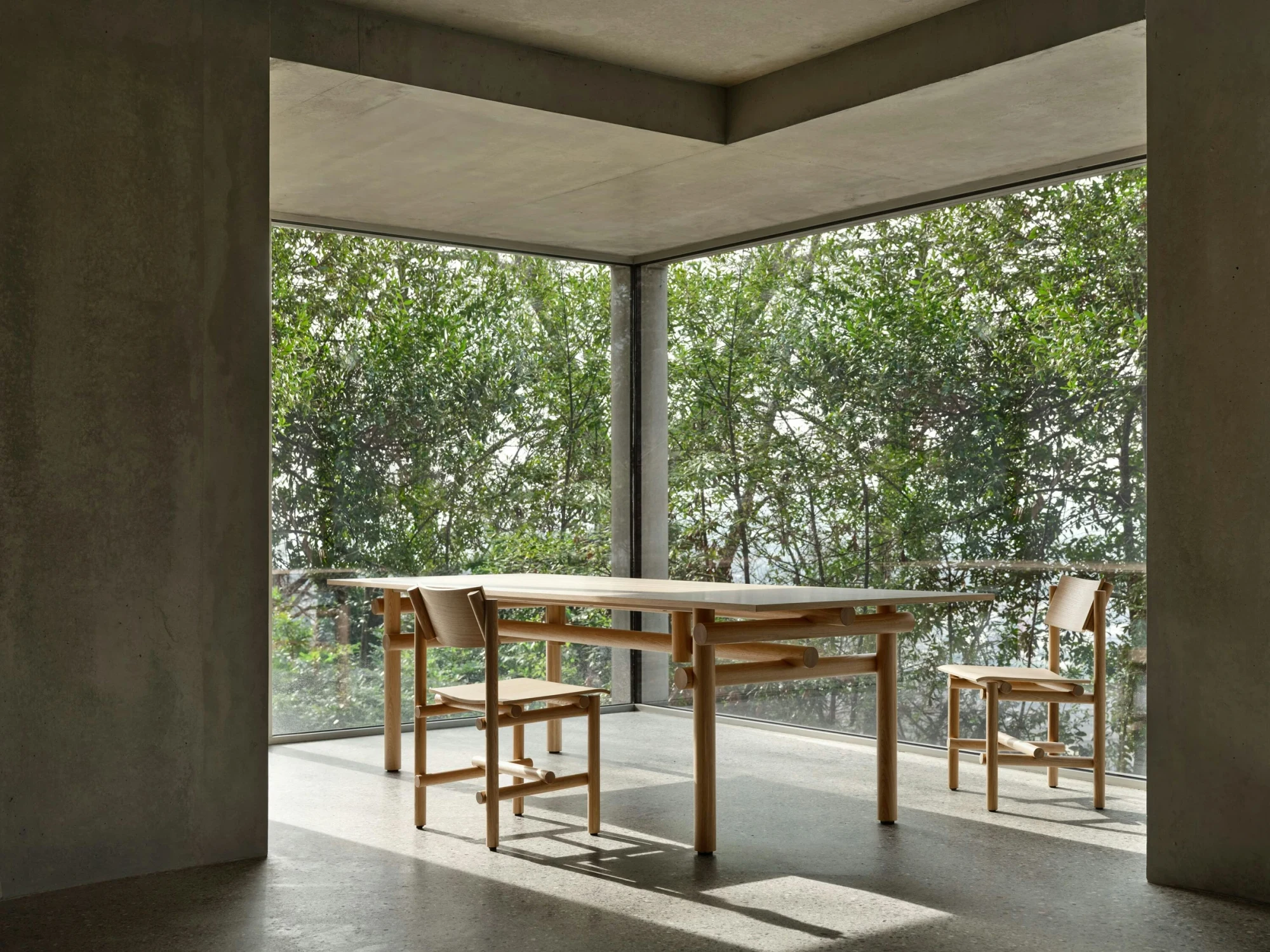 Muecke dining table with chairs in an interior