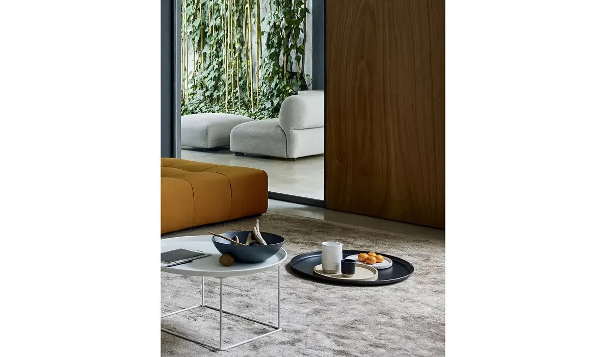 Fat-Fat tables beside a sofa, official page photo