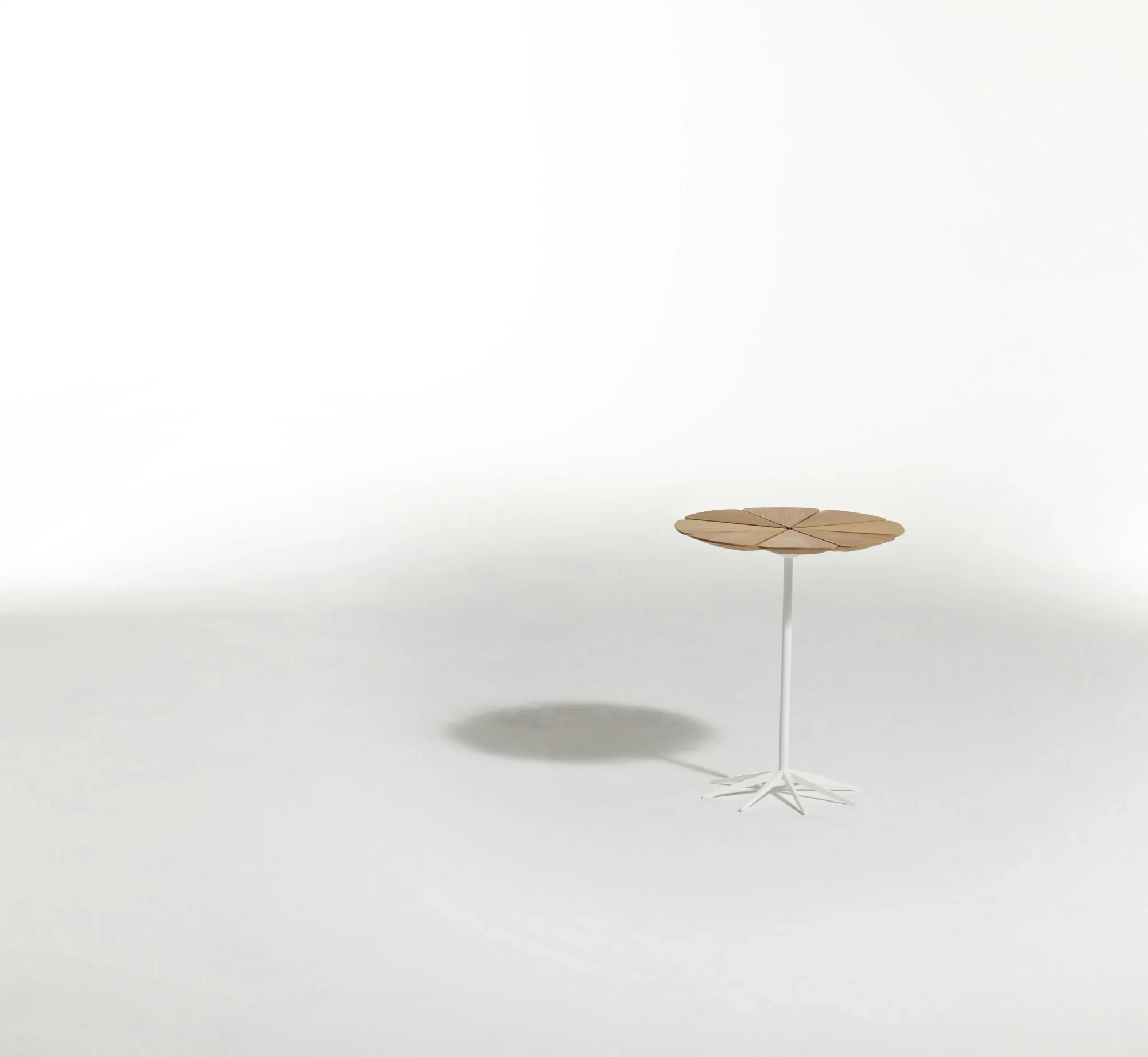 Petal End Table shown with related lounge furniture