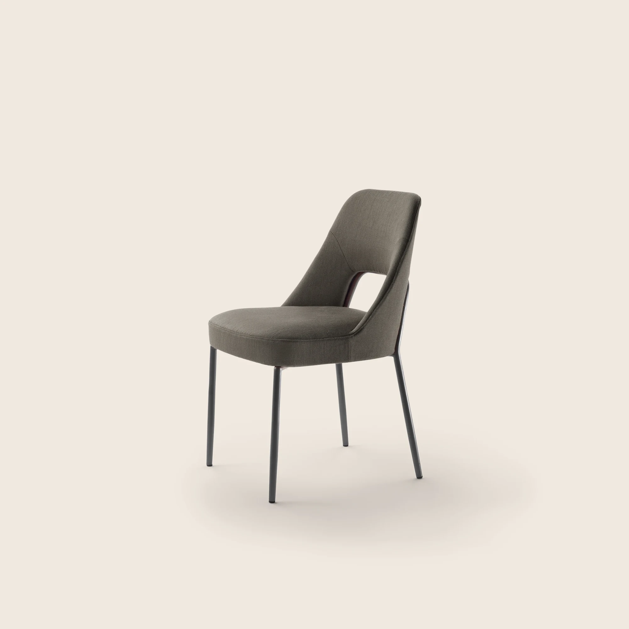 Joyce chair viewed from the side on a plain background