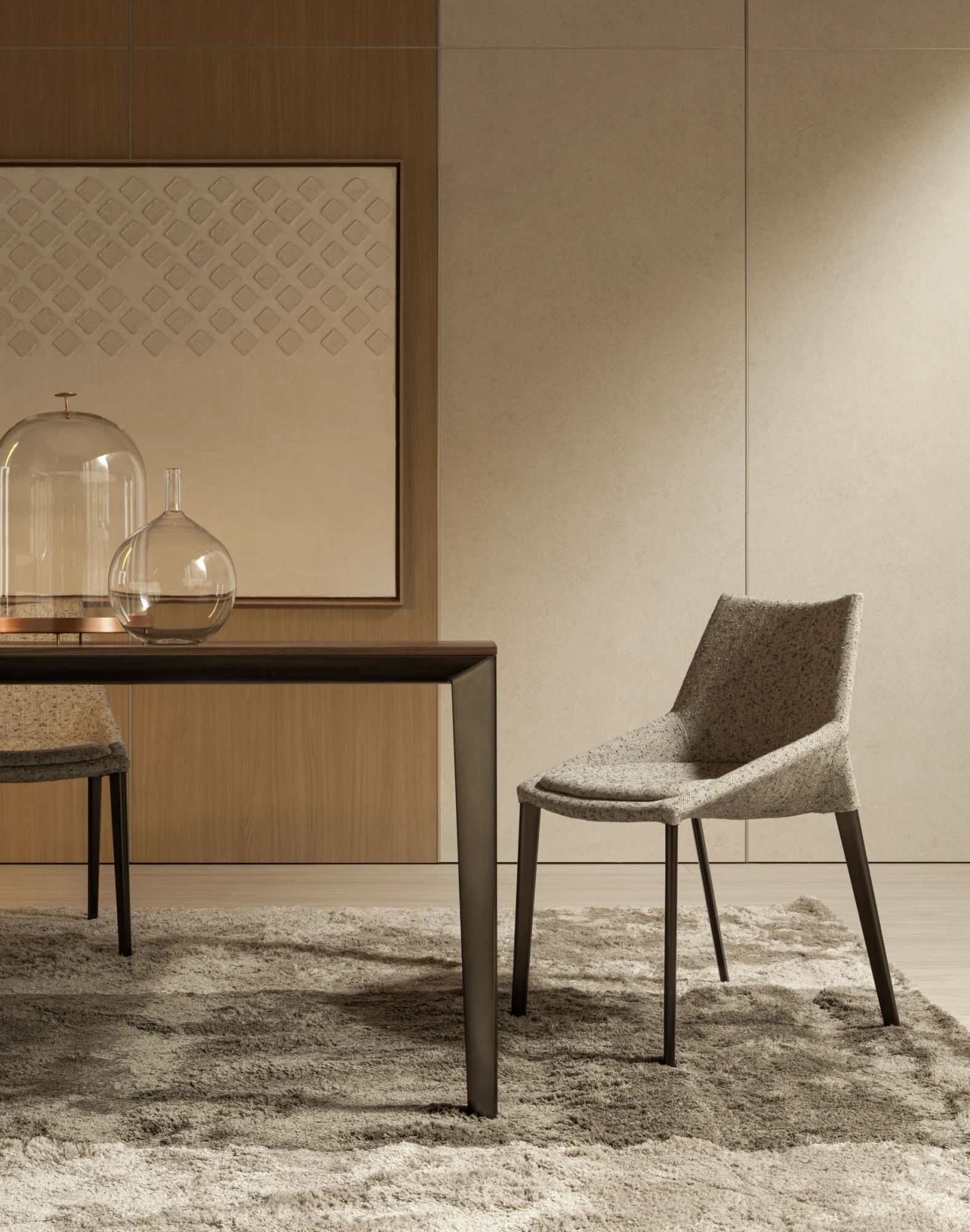 An Outline chair beside a table with domed objects on it
