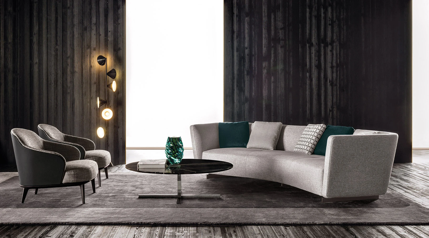 Curved Lounge Seymour sofa with two armchairs and a low round table in a room