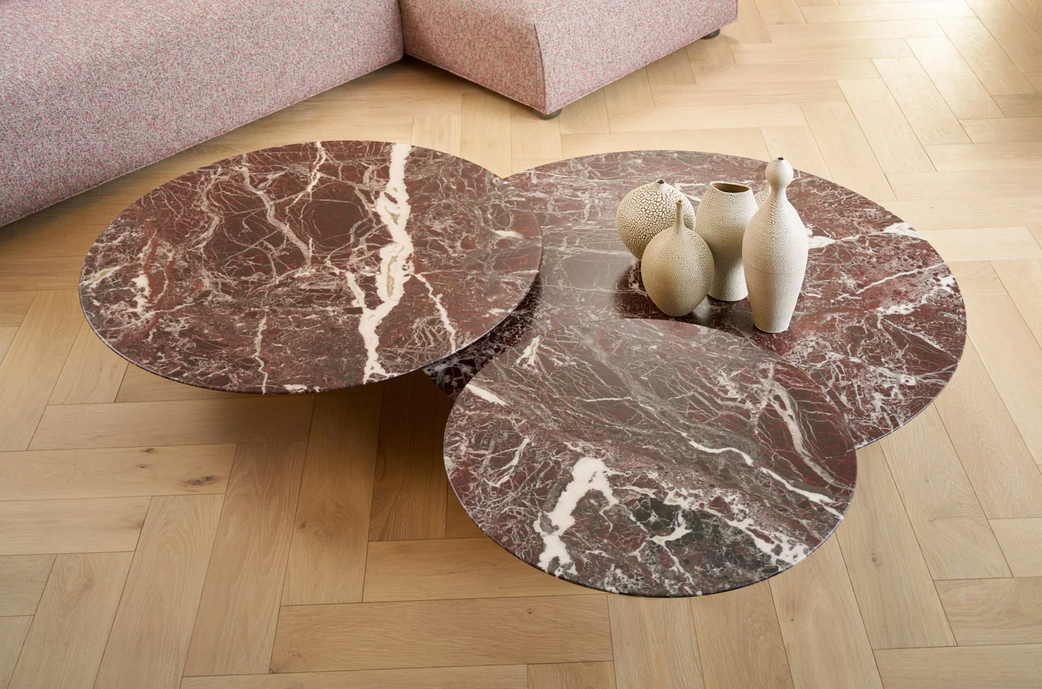Grasshopper low tables with overlapping round tops in an interior