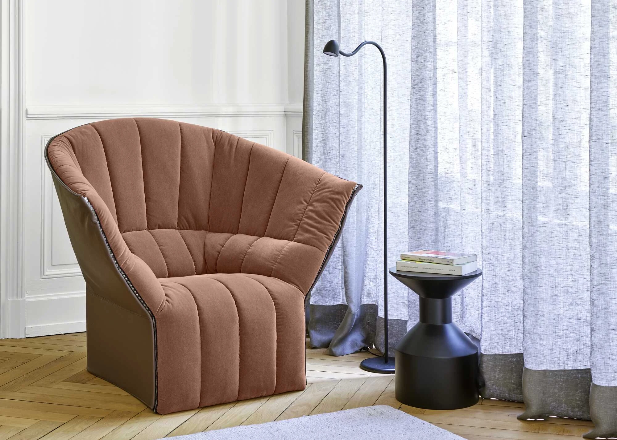 Moël low-back armchair in an official product-page composition