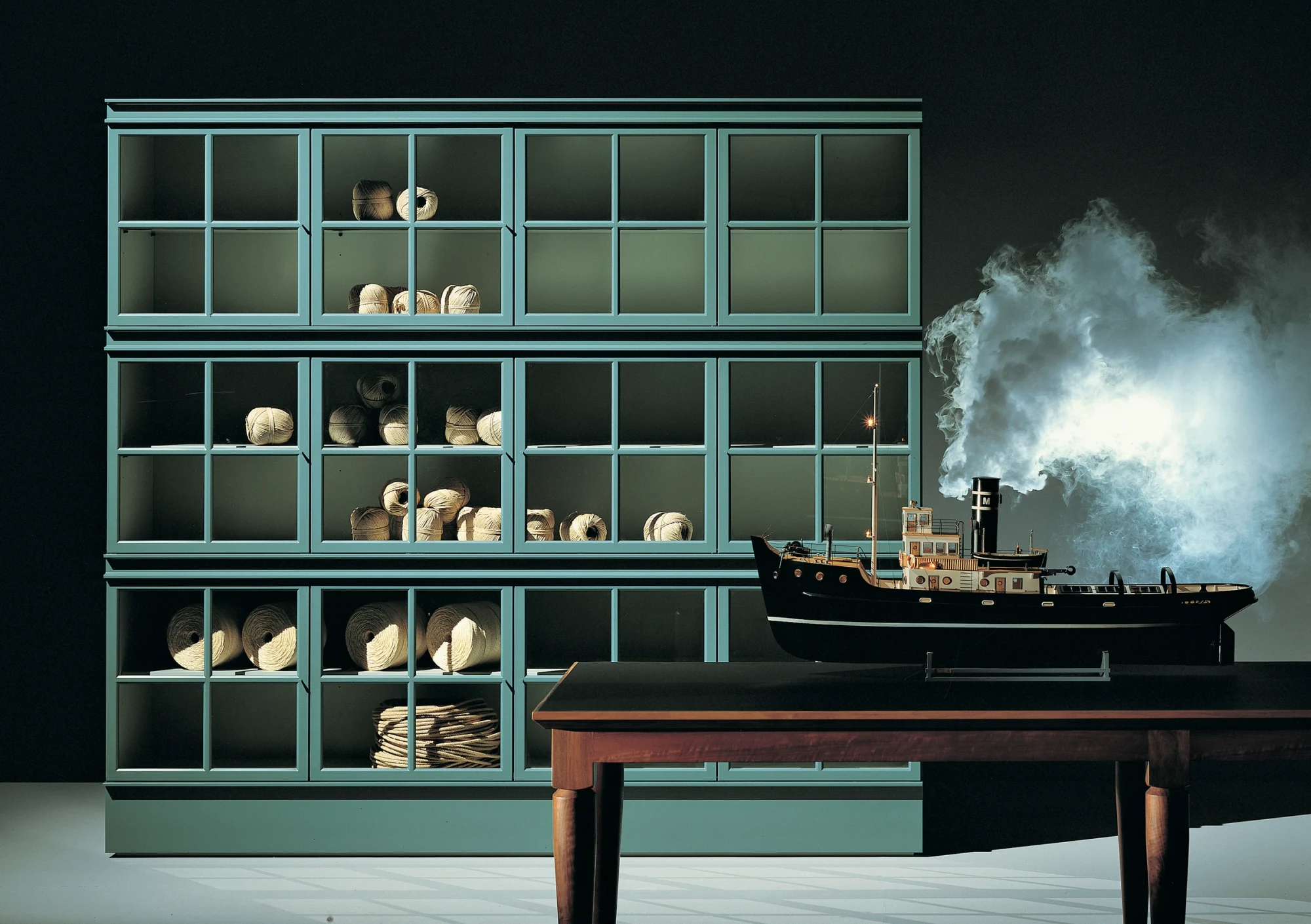 Large glazed Piroscafo composition with a model ship on a table in front