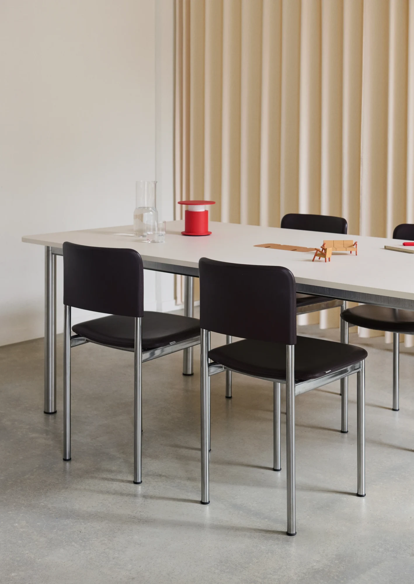 Plan Table with chairs, lifestyle image from the product page